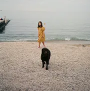 Person with dog on beach