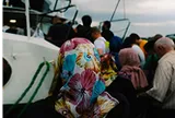 People onboarding a boat